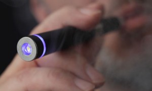 A man smoking an electronic cigarette